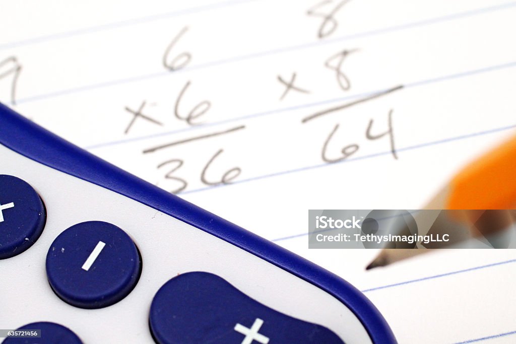 Mathematics homework problems with calculator and pencil Algebra Stock Photo