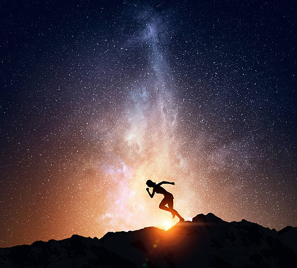 istock Jogger running at night . Mixed media 635723030