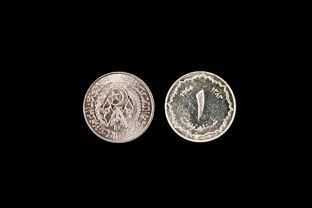 istock Old Algerian Coin On A Black Background 635723246