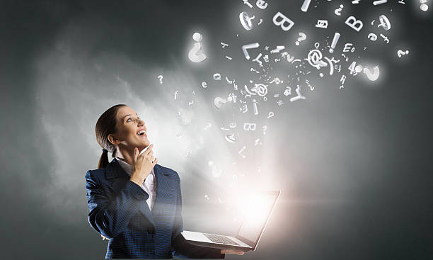 istock Elegant businesswoman thinking something over . Mixed media 635725030