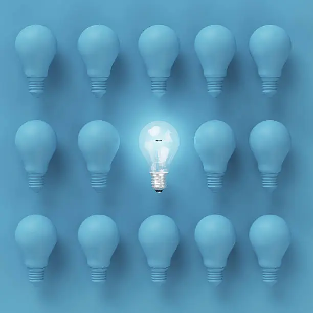 Photo of Creative light bulb Idea concept on blue background