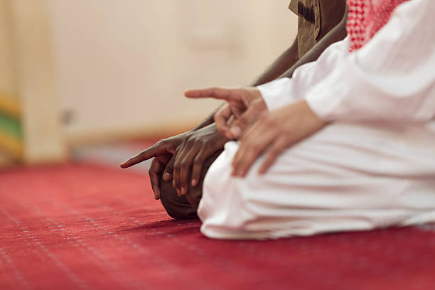 istock Two religious muslim man praying together inside the mosque 635726354