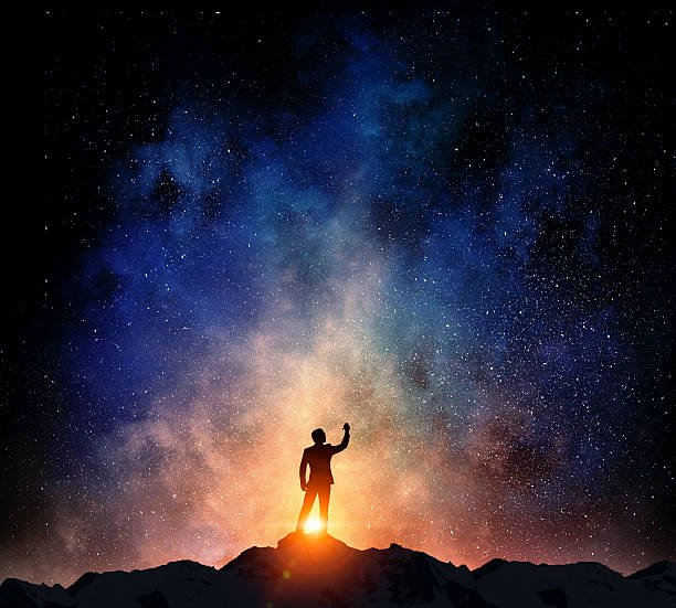 istock Businessman against starry sky . Mixed media 635726604