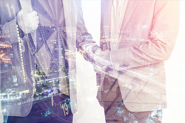 istock Double exposure of business handshake 635727996