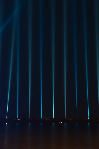 istock light beams pointing to the sky 635729628