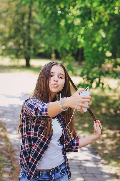 istock young beautiful girl walking park 635730428