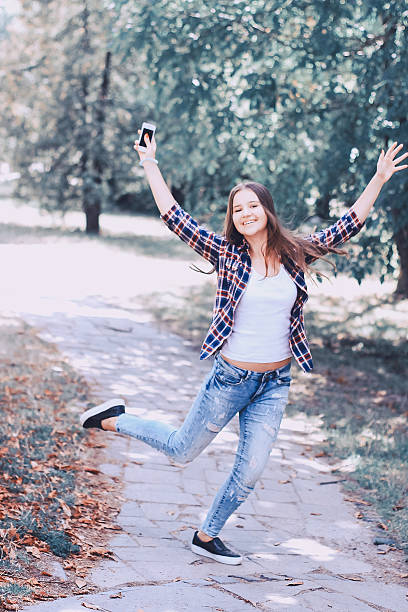 istock young beautiful girl walking park 635730502
