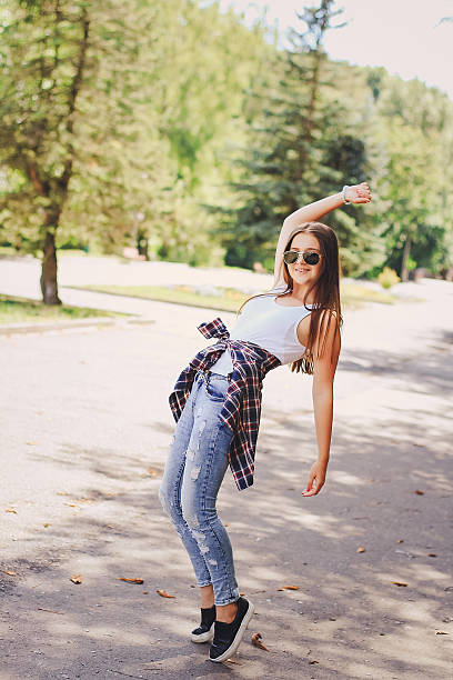 istock young beautiful girl walking park 635730662