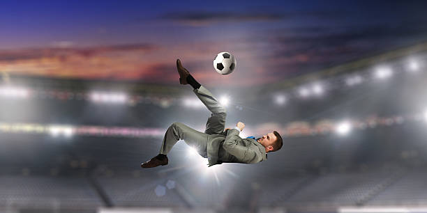 istock Businessman playing soccer . Mixed media 635730730