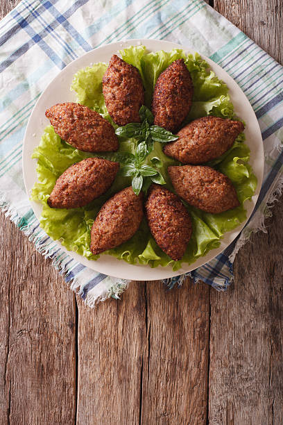 istock Arabic cuisine: meat appetizer kibbeh close-up on a plate 635732278