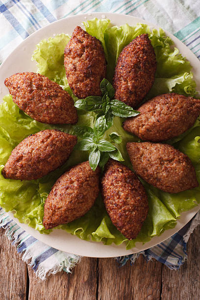 istock Arabic Kubbeh tasty meatballs close up on a plate. Vertical 635732532