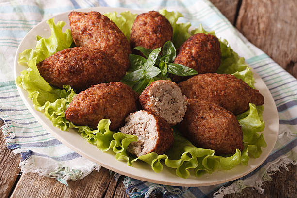 istock Hot kibbeh meatballs with bulgur and pine nuts closeup. horizontal 635732692