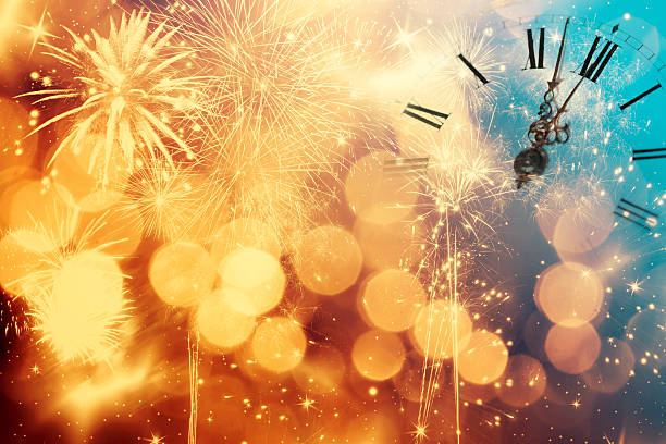 istock Abstract background with fireworks and clock close to midnight 635732716