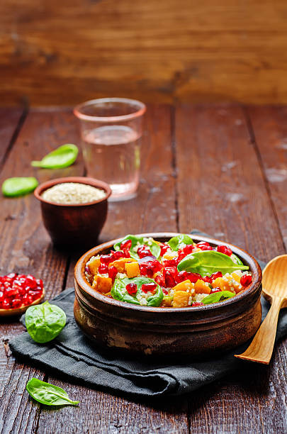 istock Pomegranate sweet potato quinoa spinach salad 635739334