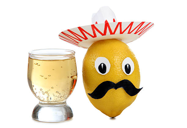 Tequila in glasses on white Tequila glass and Mexican toys vegetables on white background tequila worm stock pictures, royalty-free photos & images