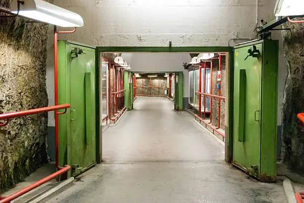 The WWII era blast doors within the Monchsberg mountain in Salzburg, Austria now leads to an underground parking garage.