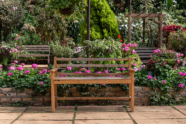istock wooden table set in a flower garden 635743750