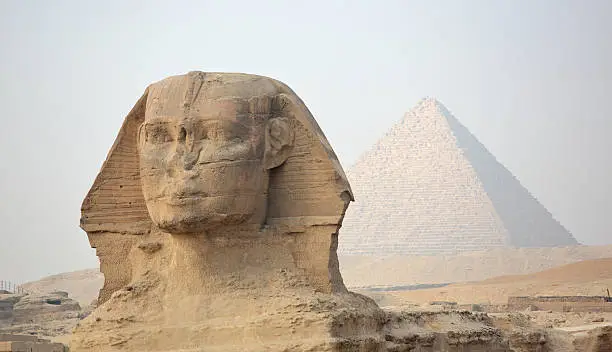The Sphinx at Giza and ancient Egyptian pyramid - Giza, Cairo, Egypt