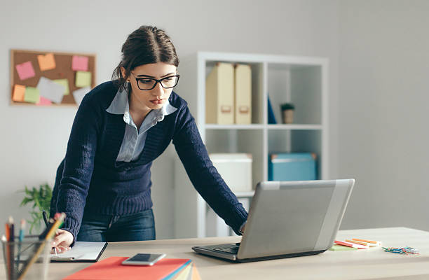 istock Businesswoman Working In Her Office 635747856