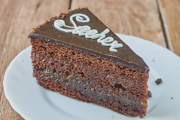 istock Delicious cake Sacher on a wooden background 635749544