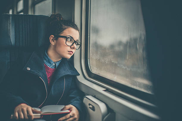 istock Girl Riding a Commuter Rail Train 635750798