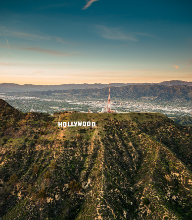 Los Angeles, California, USA - March 23, 2016: Aerial view of the Hollywood sign at dusk in Los Angeles. The image has been taken from an helicopter flying over LA.