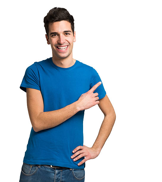 istock Young man pointing his finger to the copyspace 635754734