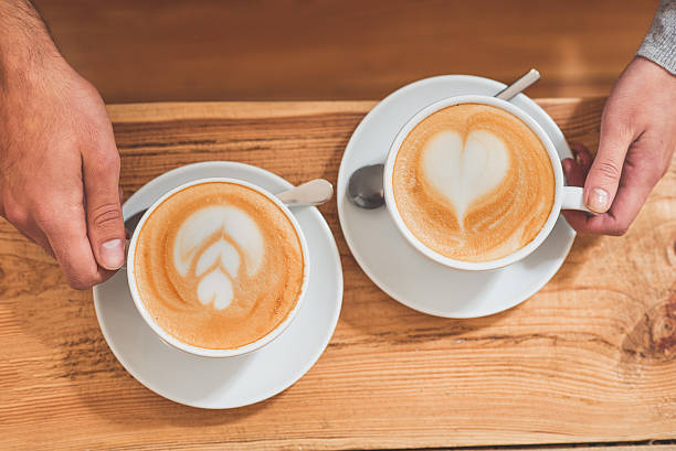 istock Loving couple drinking latte together 635754862