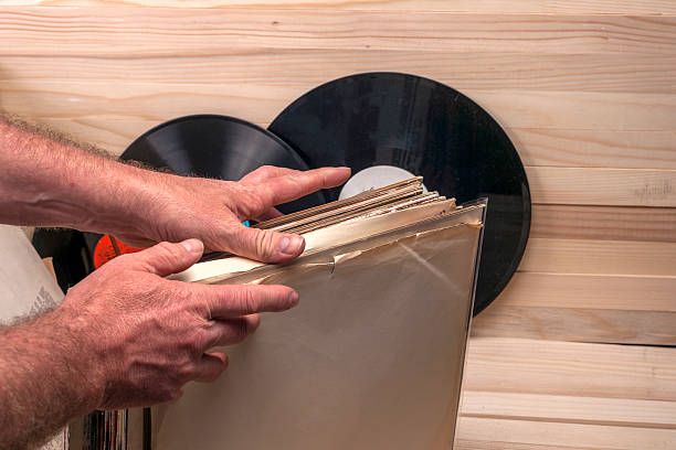 istock Browsing through vinyl records collection. Music background. Copy space 635755004