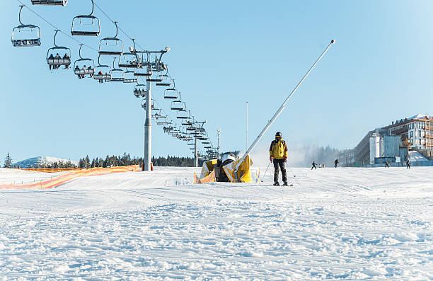 Ski slope for beginners. The ski school Polyanytsya village, Ivano-Frankivsk oblast, Ukraine - November 26, 2014: trail for beginners, ski resort "Bukovel" in the Carpathians, Ivano-Frankivsk oblast, Ukraine. The development of winter sports in Eastern Europe. Groomed snowcat snow and comfortable to ski lift bukovel ski resort ukraine stock pictures, royalty-free photos & images