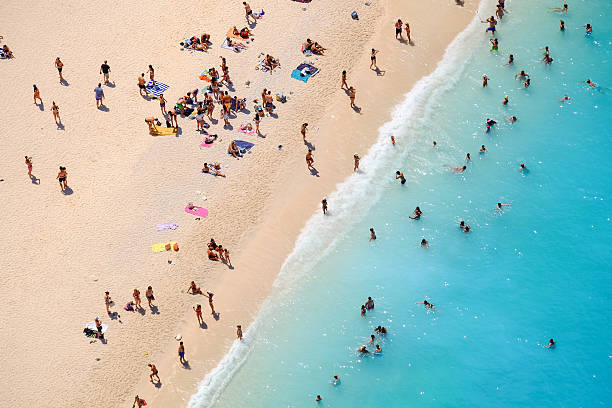 istock People bathing in the sun, swiming and playing games on 635756200