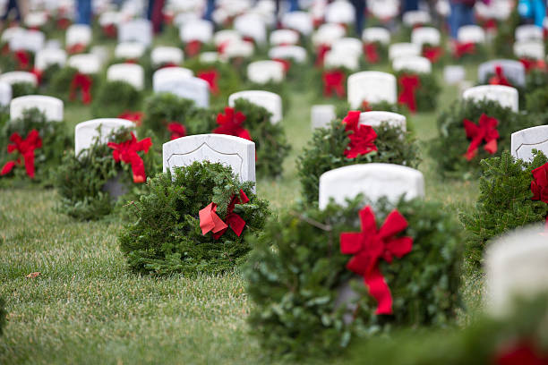 Wreaths at Arlington  National  cemetery Wreaths laid over veteran's graves as part of the annual Wreaths Over America celebration. arlington virginia photos stock pictures, royalty-free photos & images