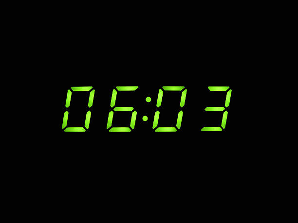 istock alarm clock with green digits 635759386
