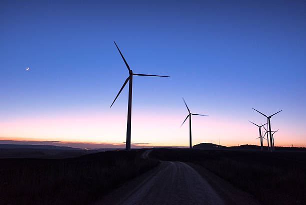 Wind farm silhouette at dusk Wind farm silhouette at dusk landscape alternative energy scenics farm stock pictures, royalty-free photos & images