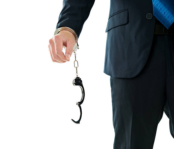 istock Businessman's hand with handcuffs 635764492