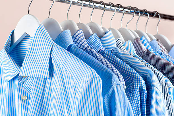 istock Cloth Hangers with Shirts. Men's clothes 635764882