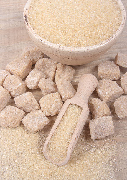 istock Cubes of sugar - brown sugar cane. 635765254
