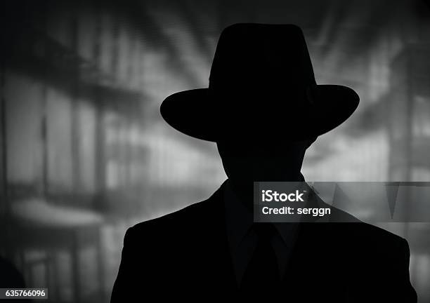 Silhouette Of A Mysterious Man In A Hat Stock Photo - Download Image Now - Villain, Gangster, Detective