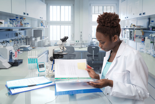 African scientist, medical worker, tech or graduate student works in modern biological laboratory