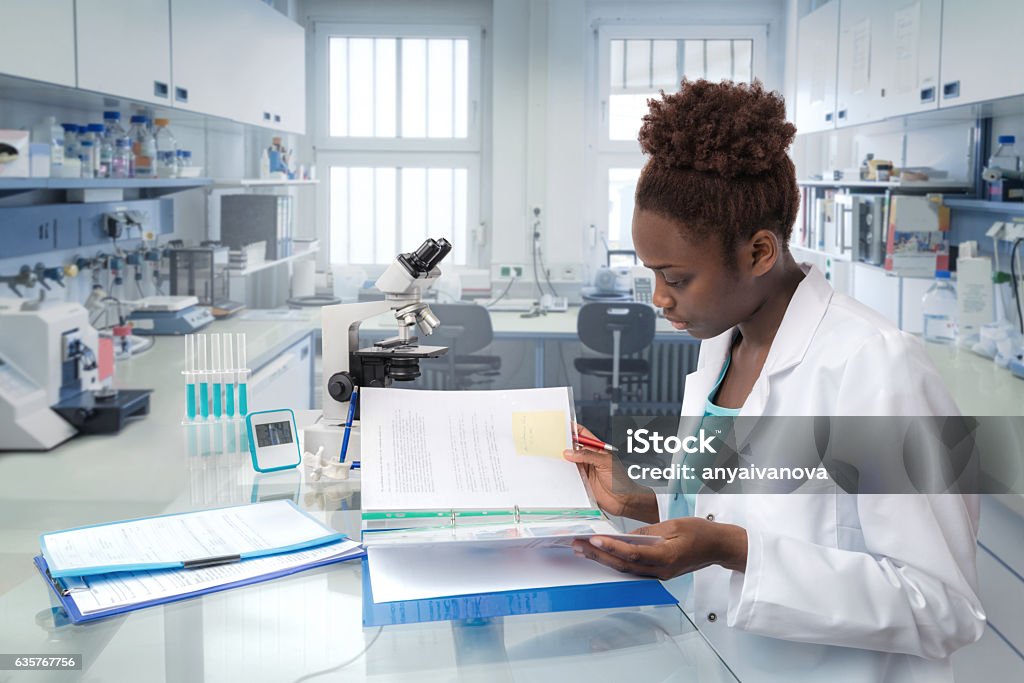 African scientist, medical worker or tech in modern laboratory African scientist, medical worker, tech or graduate student works in modern biological laboratory Healthcare And Medicine Stock Photo