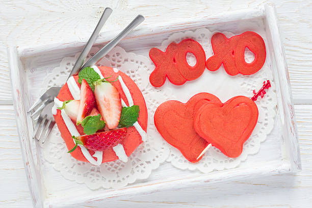 istock Stack of red velvet pancakes with xo sign, top view 635770808