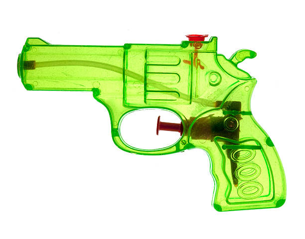 pistola de juguete verde neón - pistola de agua fotografías e imágenes de stock