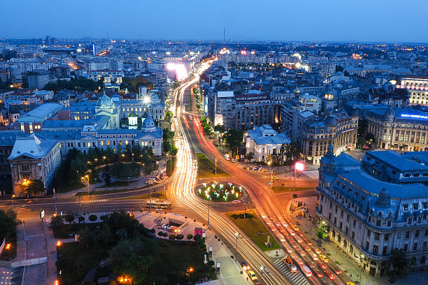 bucharest city at night. university square, km 0 of the - romania imagens e fotografias de stock