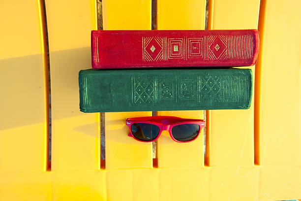 Book on the beach of blue sea. Back to school. 