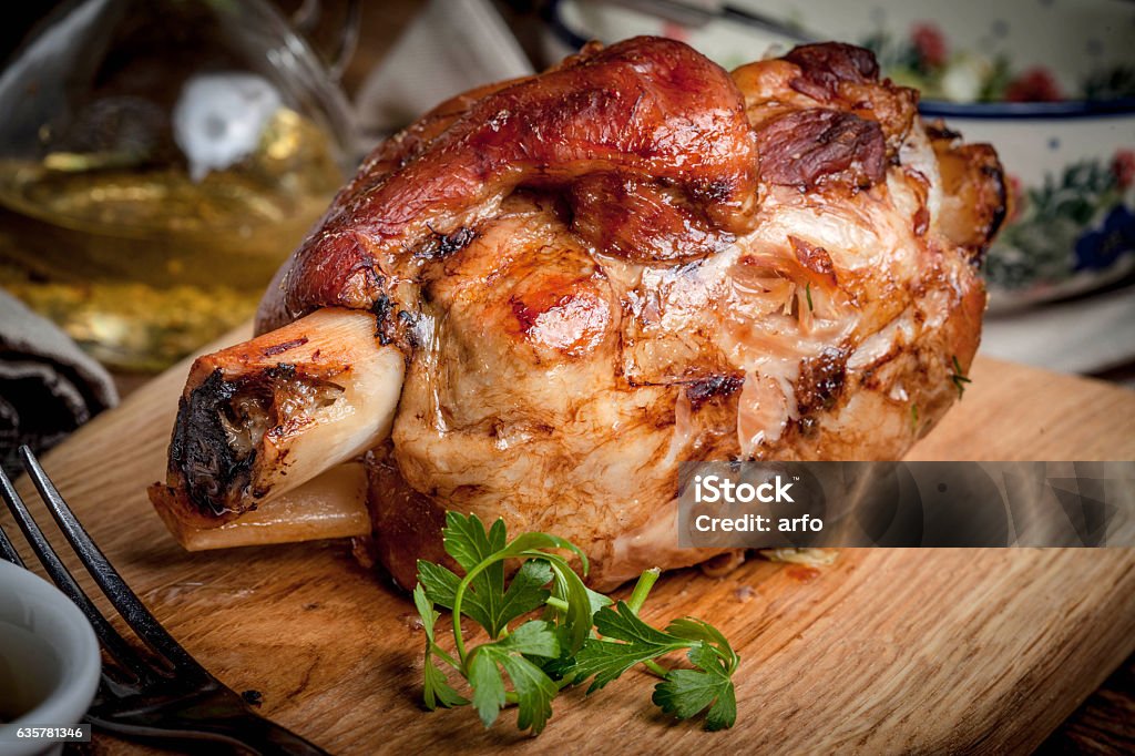 Roast pork knuckle. Roast pork knuckle on a wooden board. Selective focus. Shank Stock Photo