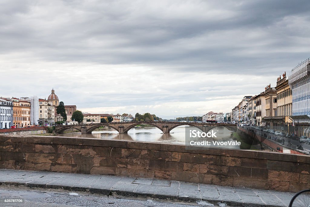 view of bridges and quay in Florence in autumn travel to Italy - view of ponte alla carraia and quay Lungarno Corsini in Florence city from bridges ponte santa trinita in autumn Architecture Stock Photo
