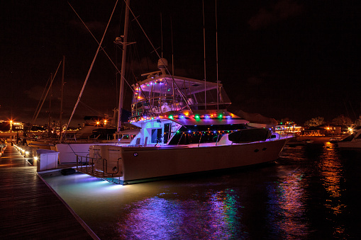 Newport Beach, CA, USA -December 16, 2016: Colorful holiday lights on sailboats and ships in the Balboa Harbor for the Newport Beach Christmas Boat Parade. Editorial use only.