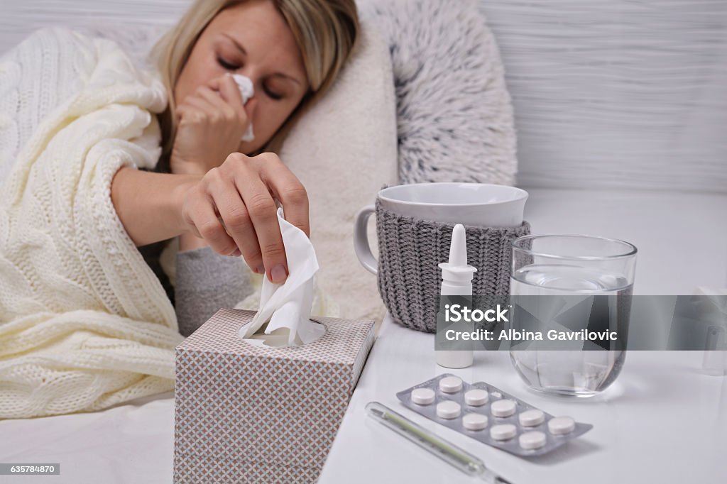 Woman caught cold , flu, running nose. Healthcare and medical concept Adult Stock Photo