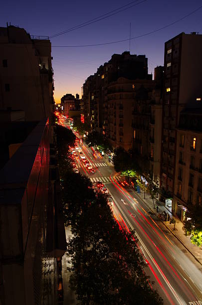 istock Car light trails on a city road 635788746