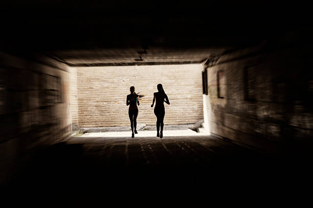 istock Young women jogging in underpass 635790180